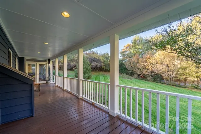 a view of a chair and table in the balcony