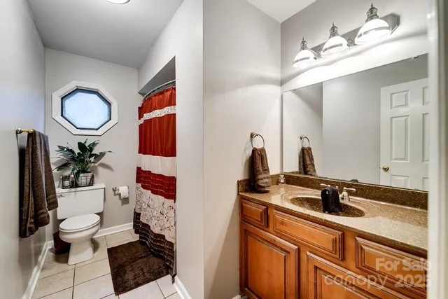 a room with a washing machine and a flat screen tv