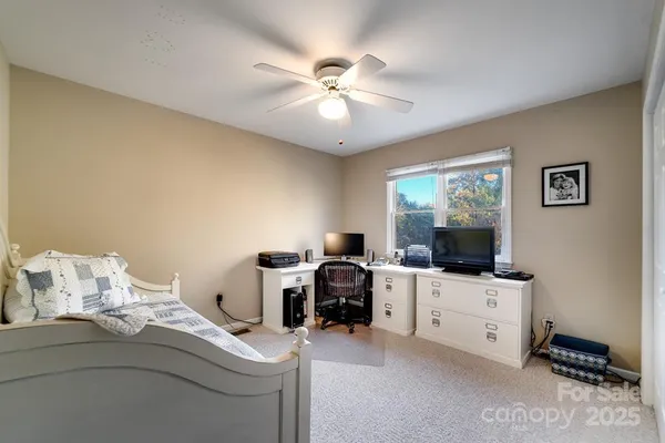 a room with furniture and flat screen tv