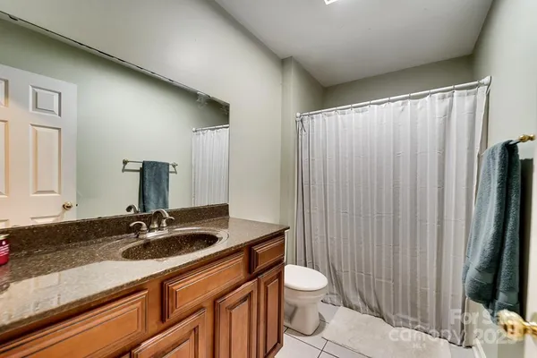 a bedroom with a bed closet and window