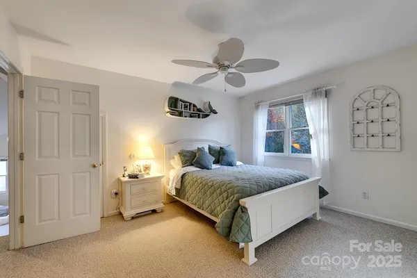 a living room with furniture and a book shelf