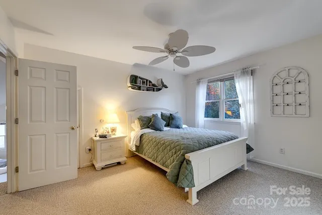 a living room with furniture and a book shelf