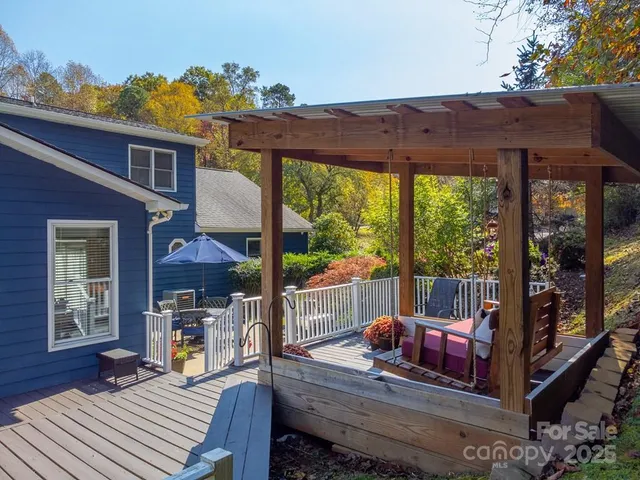 a view of a patio with a table chairs and a porch