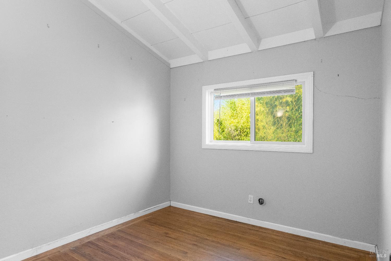 1219 Janet Way Santa Rosa, CA 95405 - Photo 12 of 22 a view of an empty room with wooden floor and a window