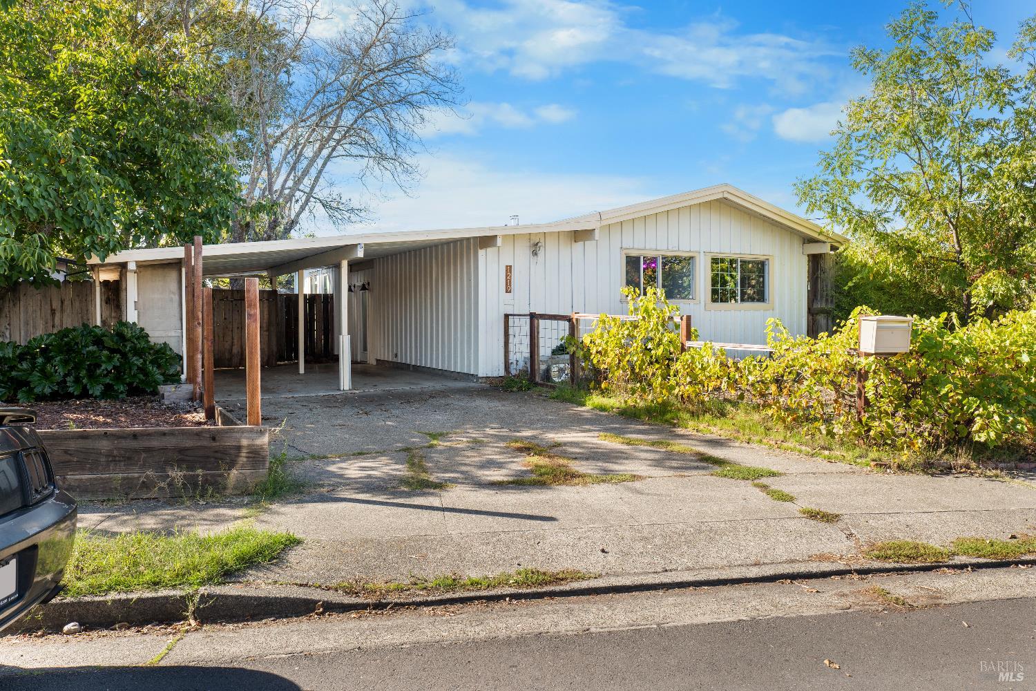 1219 Janet Way Santa Rosa, CA 95405 - Photo 2 of 22 a front view of house with yard and trees in the background