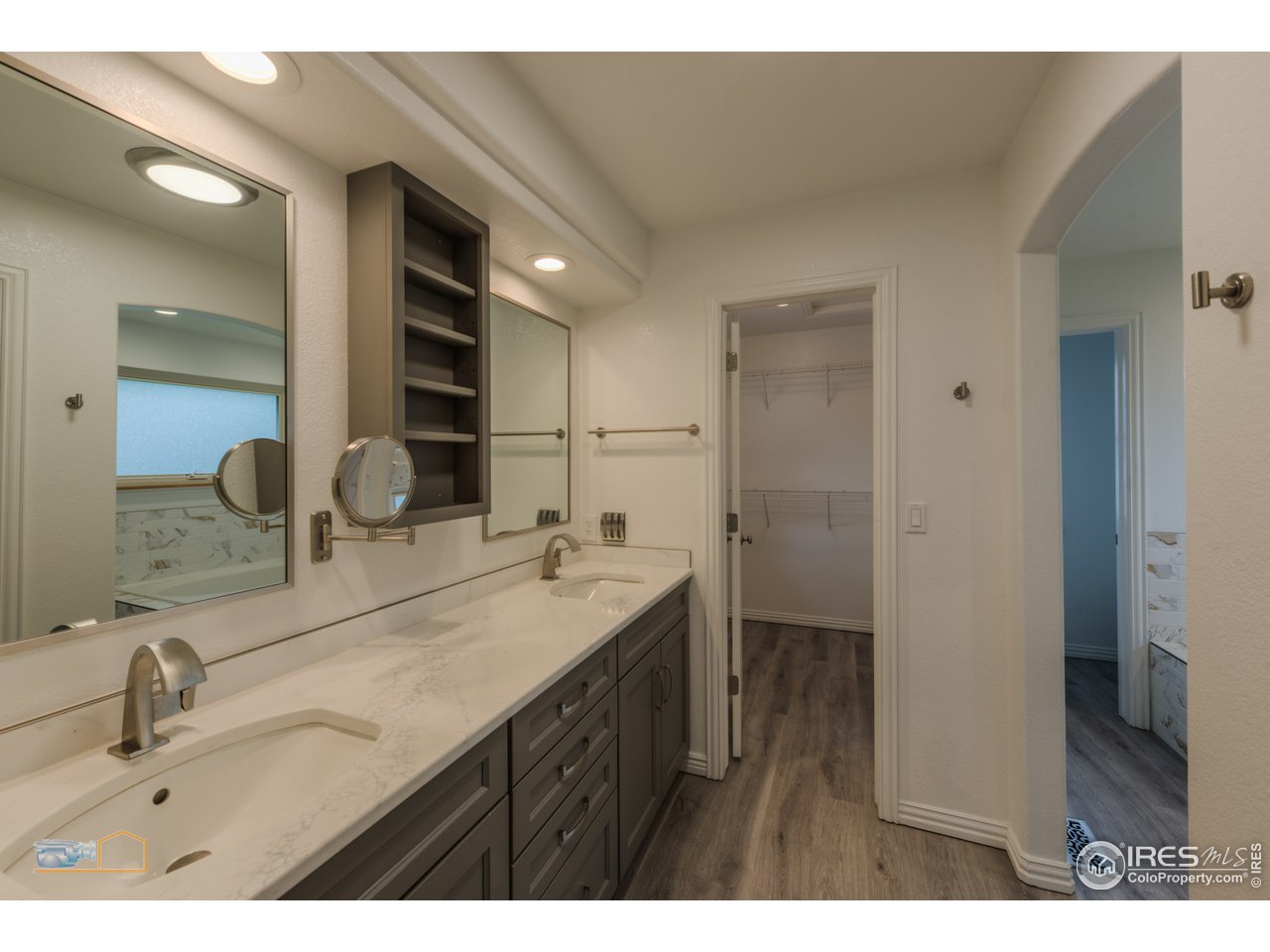5933 Wellington Road Boulder, CO 80301 - Photo 16 of 39 a bathroom with a sink double vanity and a mirror