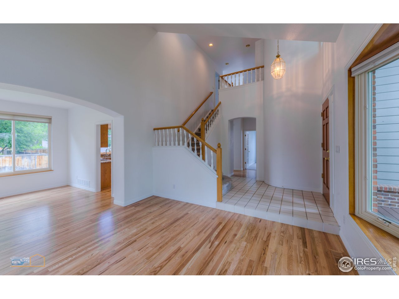 5933 Wellington Road Boulder, CO 80301 - Photo 3 of 39 a view of empty room with wooden floor and fan