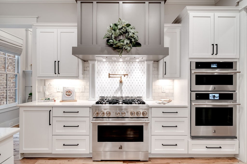 108 Alpine Court Franklin, TN 37069 - Photo 13 of 42 a kitchen with stainless steel appliances a stove and a microwave
