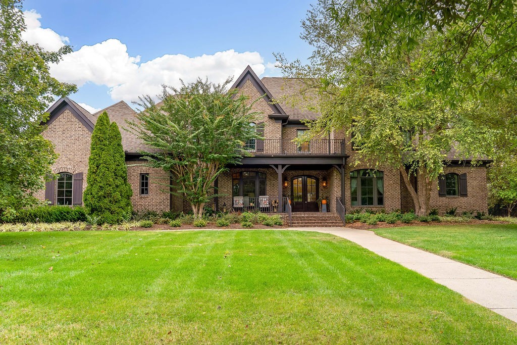 108 Alpine Court Franklin, TN 37069 - Photo 2 of 42 a view of a house with a yard and sitting area