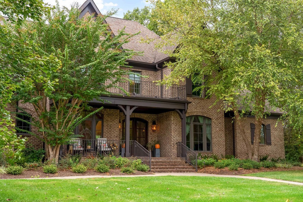 108 Alpine Court Franklin, TN 37069 - Photo 3 of 42 a view of a house with potted plants and a large tree