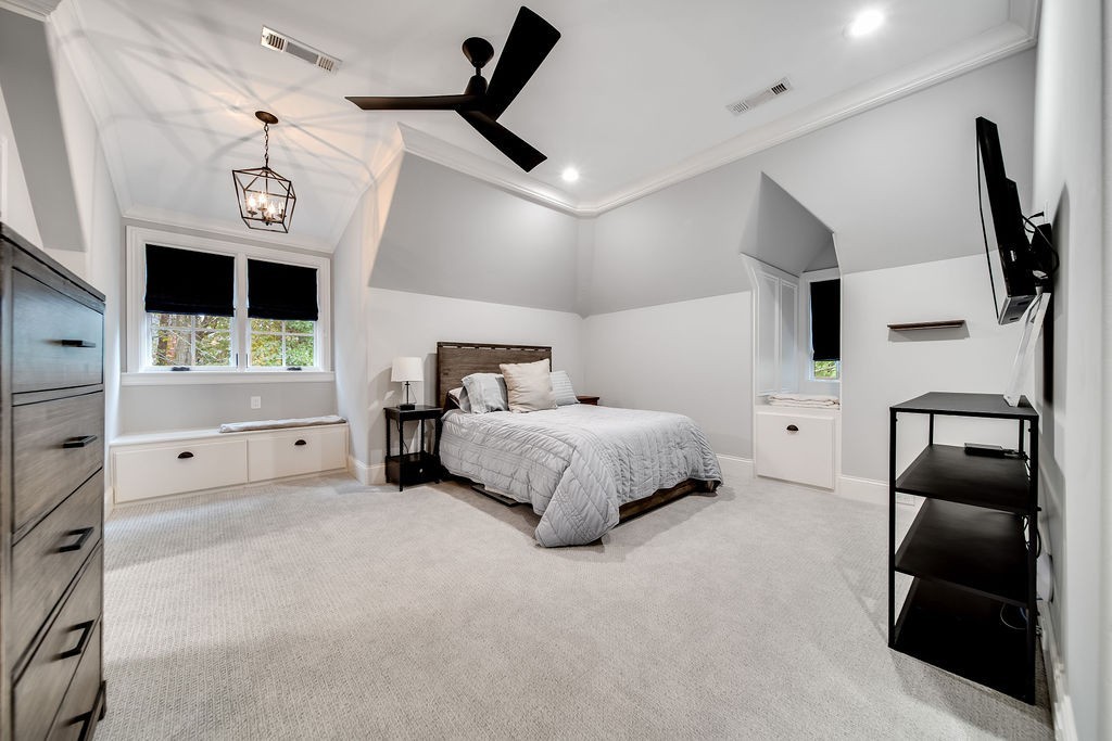 108 Alpine Court Franklin, TN 37069 - Photo 31 of 42 a bedroom with a bed and a television on the wall