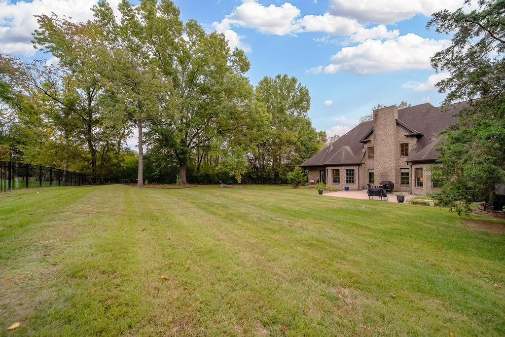 108 Alpine Court Franklin, TN 37069 - Photo 39 of 42 a view of a big house with a big yard and large trees