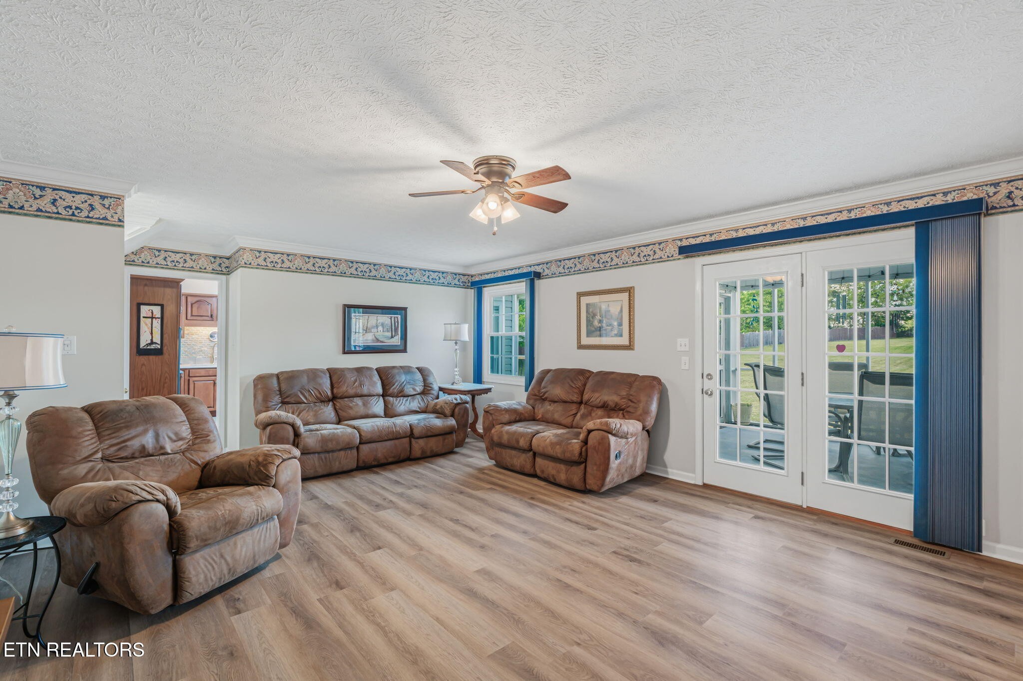 7030 Westerly Winds Road Knoxville, TN 37931 - Photo 15 of 40 a living room with furniture and a large window
