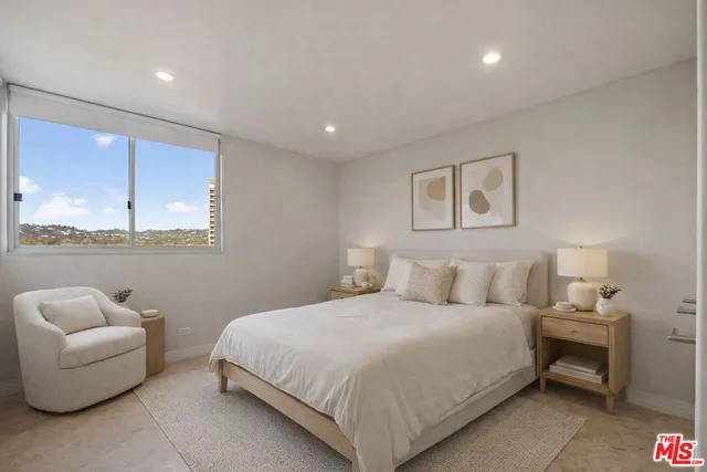 a bedroom with a bed and a couch