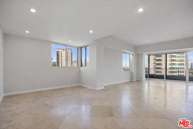 a view of a room with a large window