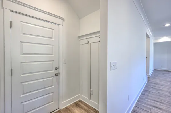 a bathroom with a glass door shower a sink and a mirror