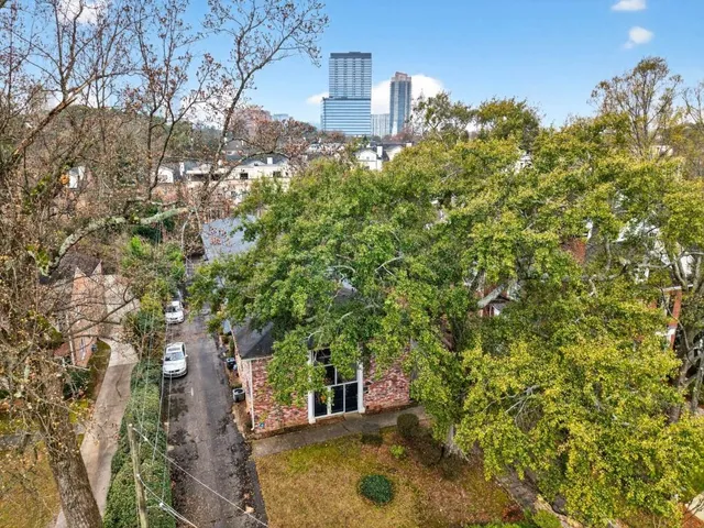 a view of a house with a tree