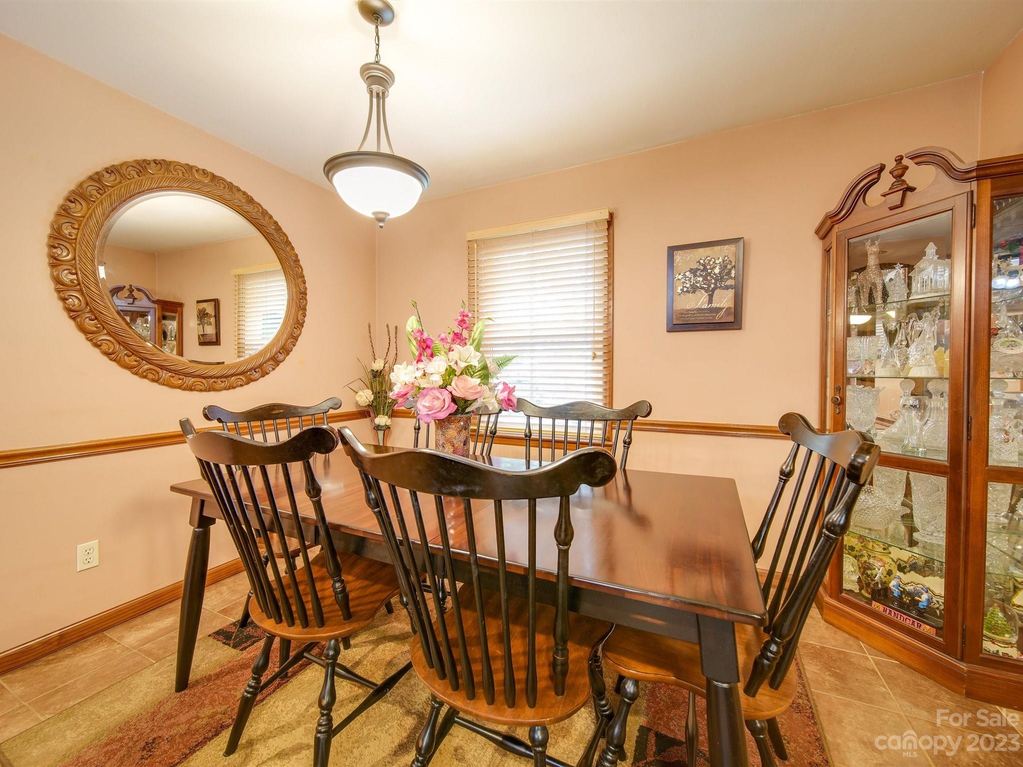 3403 Stack Road Monroe, NC 28112 - Photo 11 of 31 a view of a dining room with furniture and a chandelier