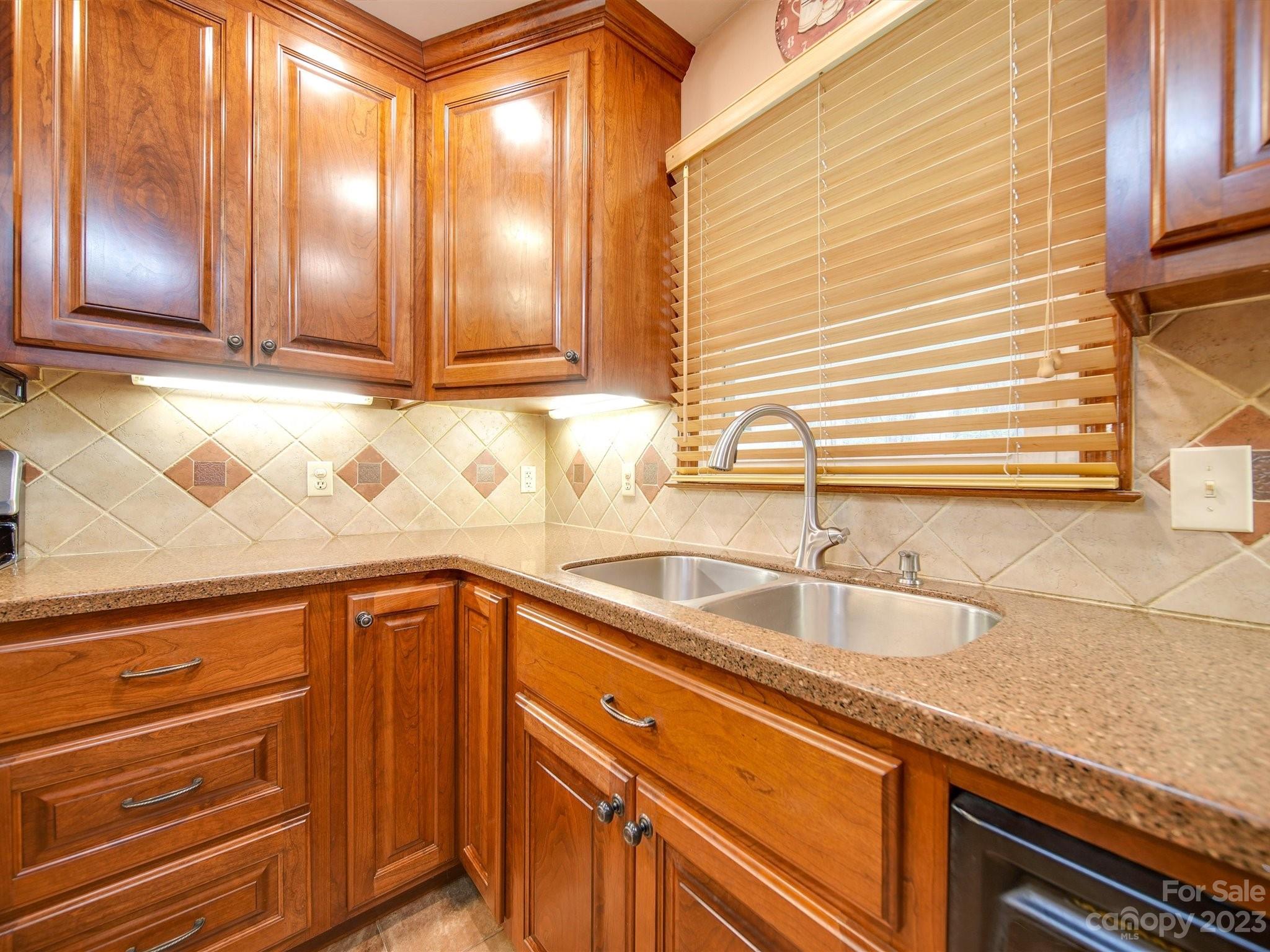3403 Stack Road Monroe, NC 28112 - Photo 13 of 31 a kitchen with granite countertop a sink and cabinets