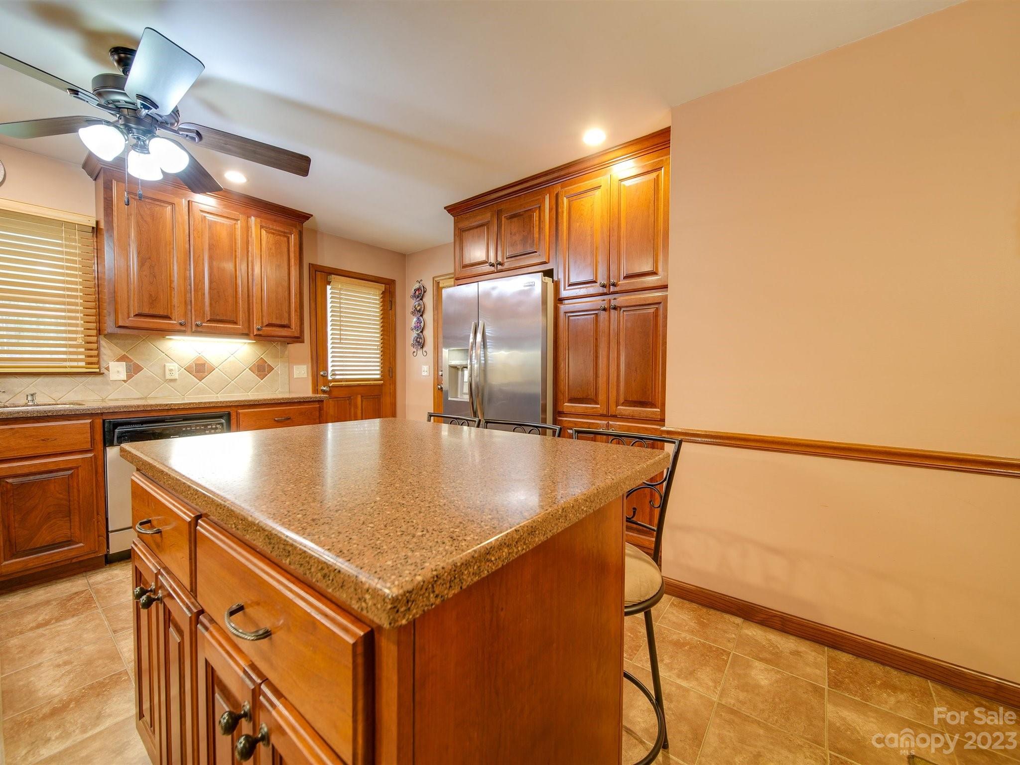 3403 Stack Road Monroe, NC 28112 - Photo 15 of 31 a kitchen with a sink a refrigerator and cabinets