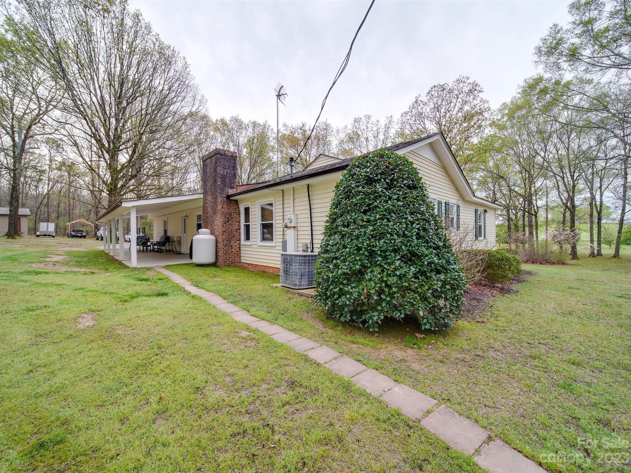 3403 Stack Road Monroe, NC 28112 - Photo 23 of 31 a front view of a house with garden