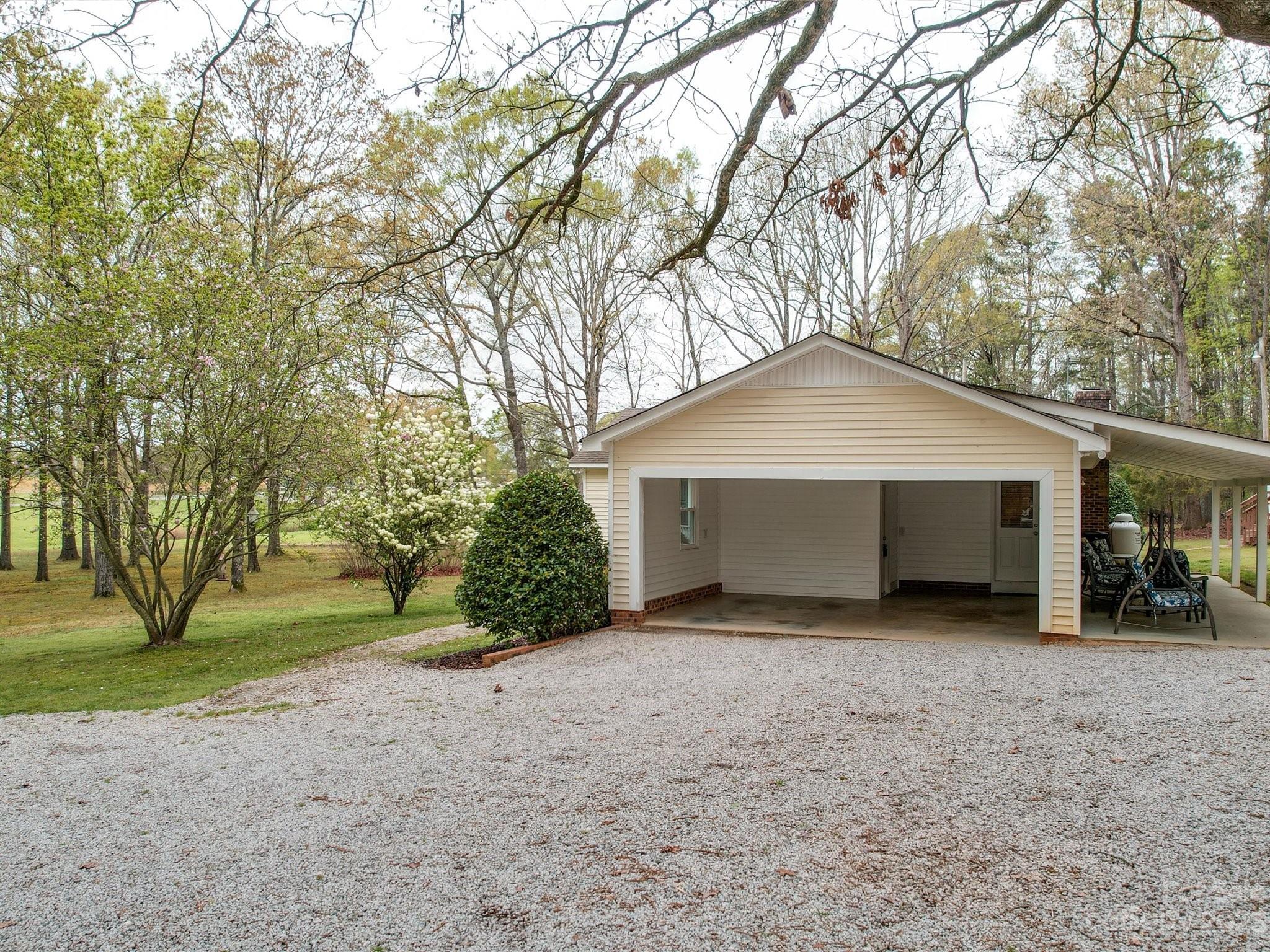 3403 Stack Road Monroe, NC 28112 - Photo 25 of 31 a front view of a house with a yard and garage