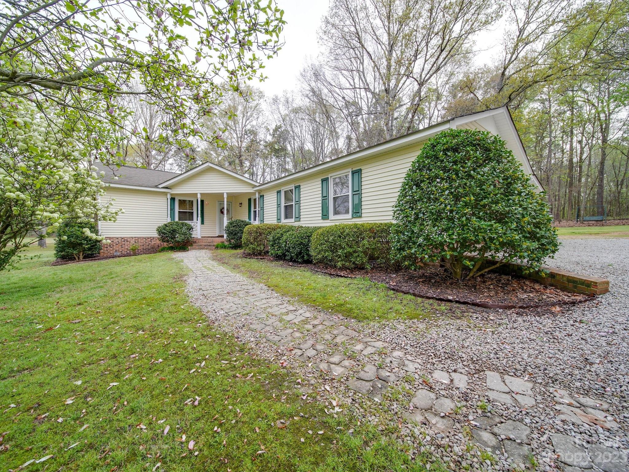 3403 Stack Road Monroe, NC 28112 - Photo 4 of 31 a front view of a house with a yard and trees
