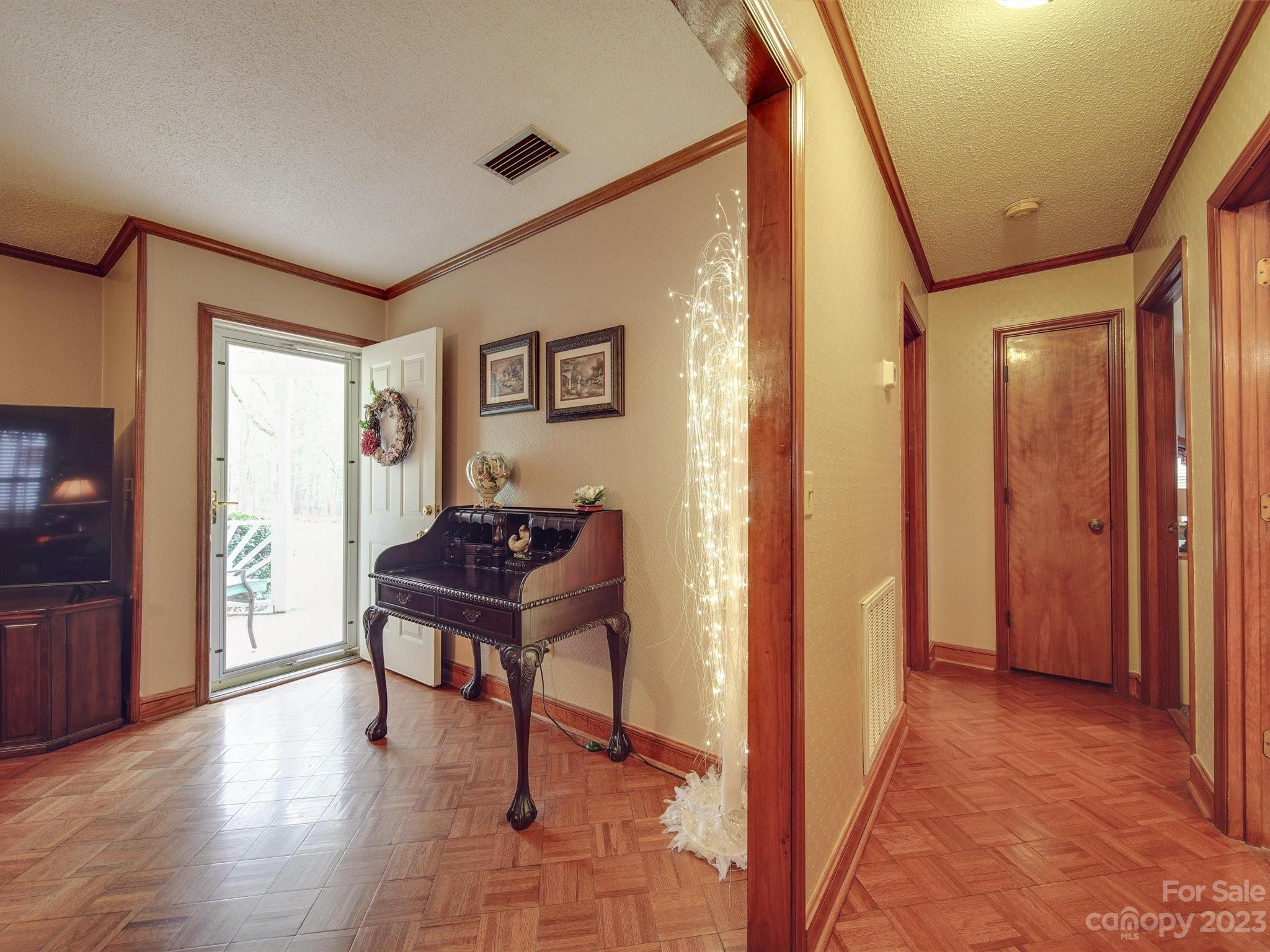 3403 Stack Road Monroe, NC 28112 - Photo 5 of 31 a view of a hallway with wooden floor and furniture