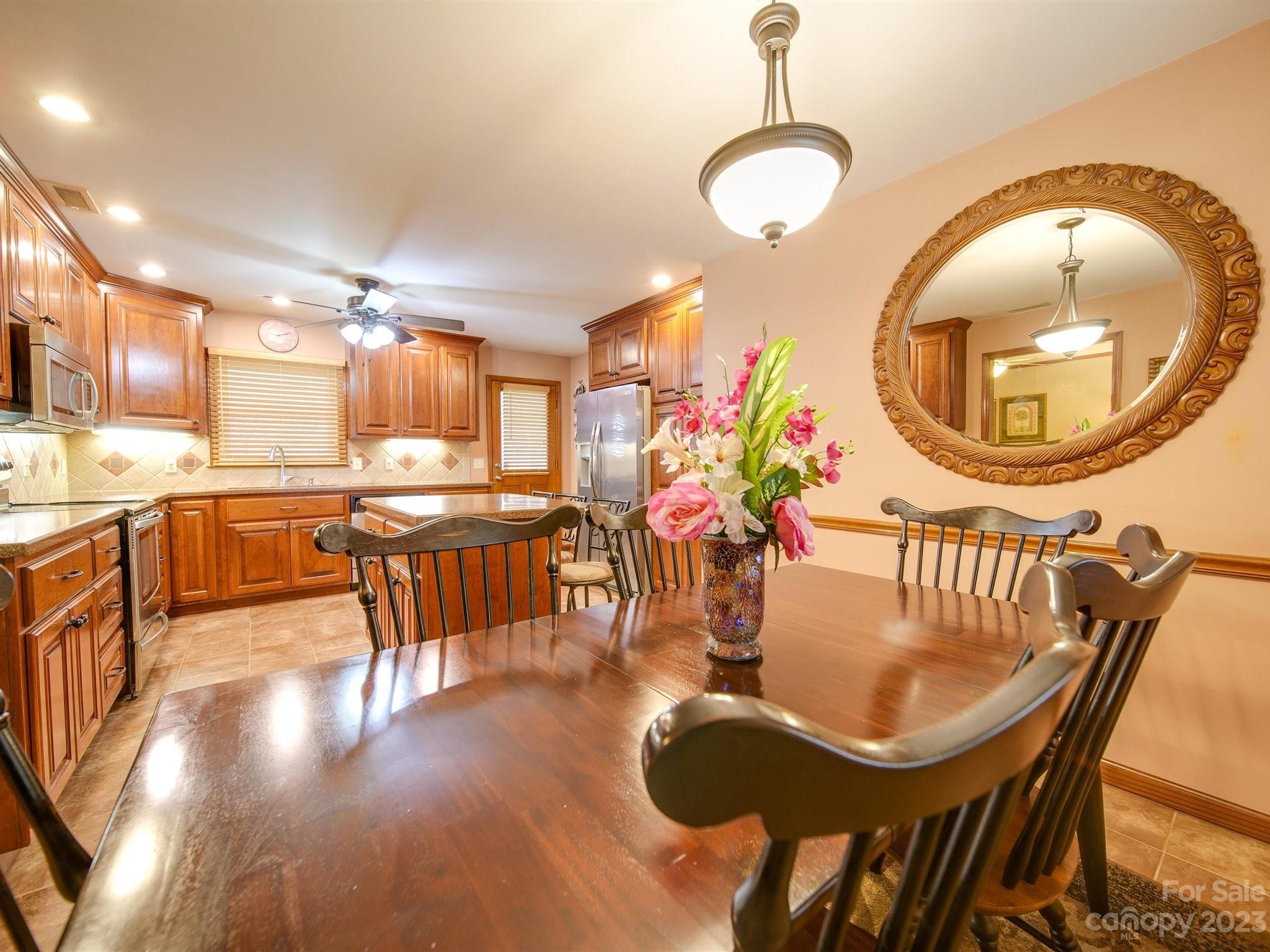 3403 Stack Road Monroe, NC 28112 - Photo 10 of 31 a dining room with furniture and a wooden floor