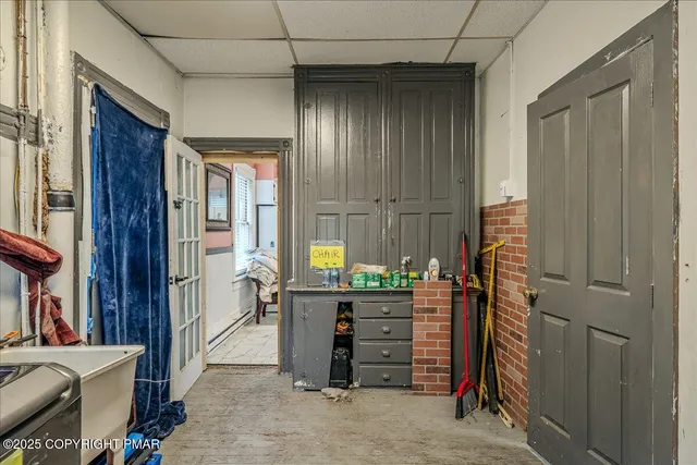 a bedroom with furniture and a flat screen tv