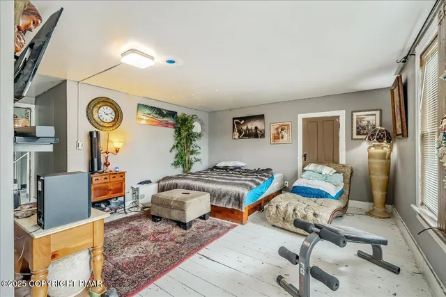 a bathroom with a sink a mirror and a shower