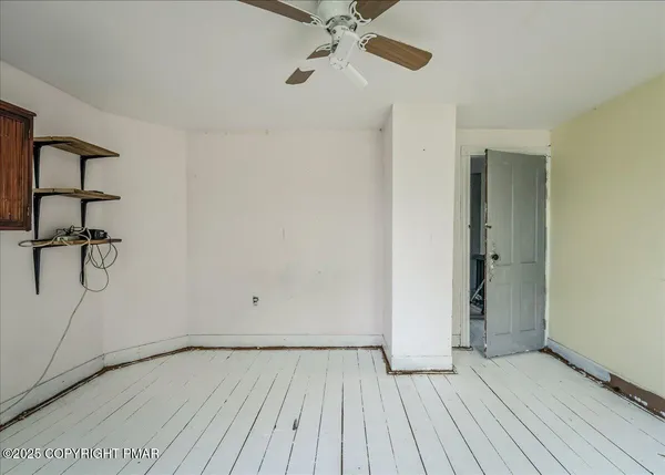 a view of walk in closet with clothes