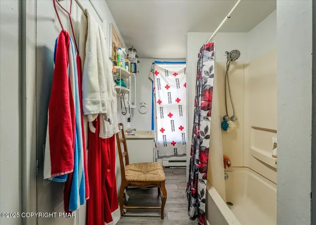 a view of an entryway with wooden floor