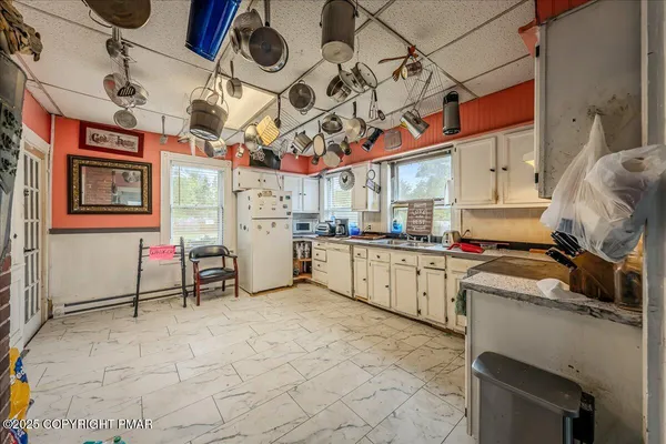 a kitchen with stainless steel appliances granite countertop a sink and cabinets