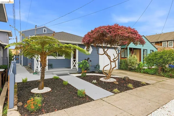 a front view of a house with garden