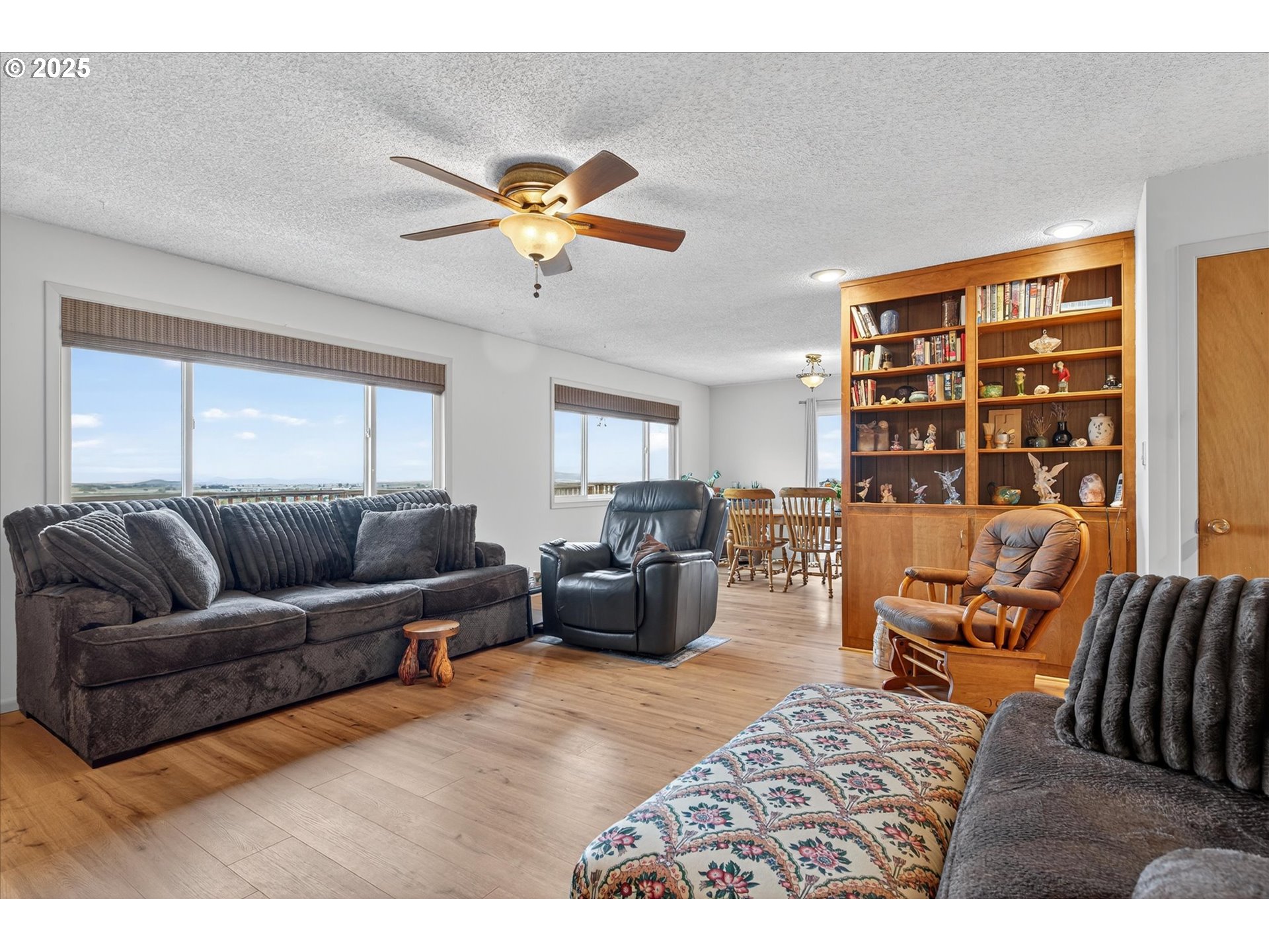 1025 17th Street Baker City, OR 97814 - Photo 17 of 48 a living room with furniture and a large window