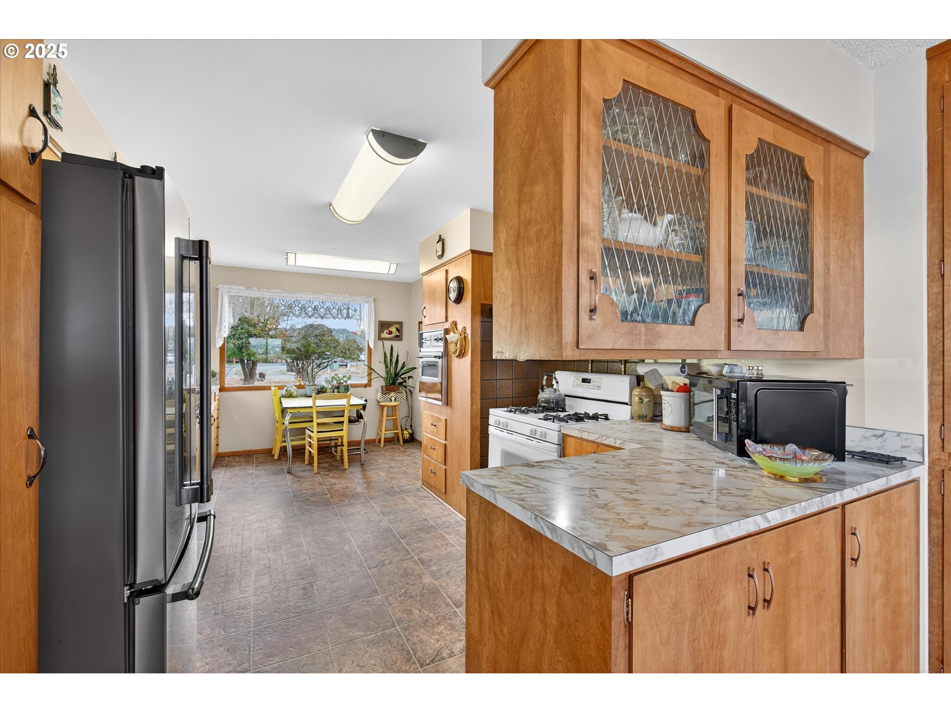 1025 17th Street Baker City, OR 97814 - Photo 19 of 48 a kitchen with sink and refrigerator
