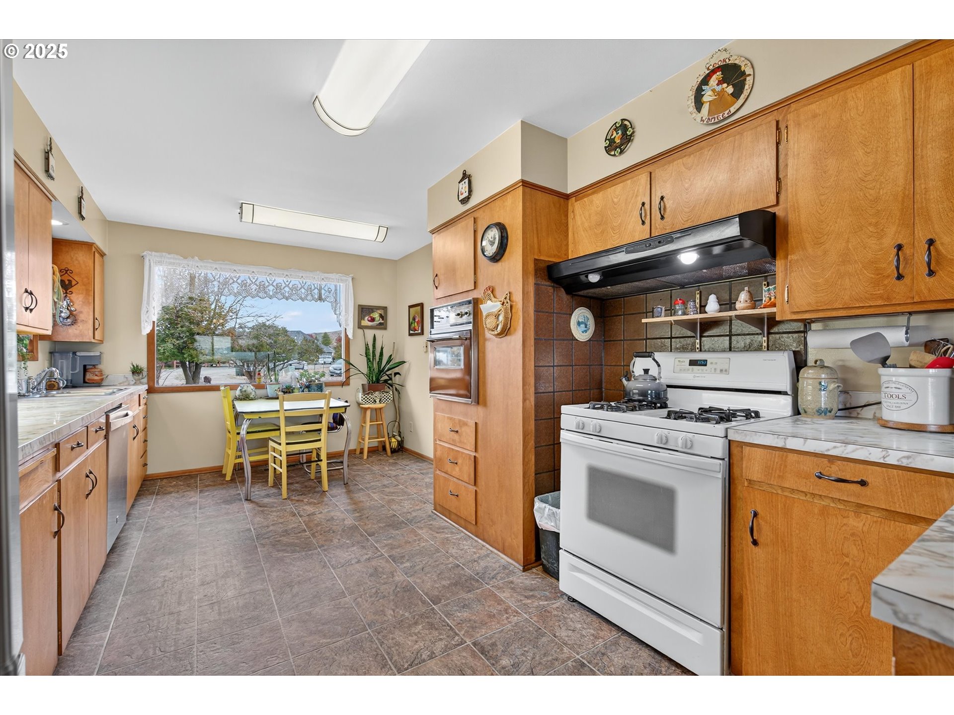 1025 17th Street Baker City, OR 97814 - Photo 20 of 48 a kitchen with sink cabinets and table