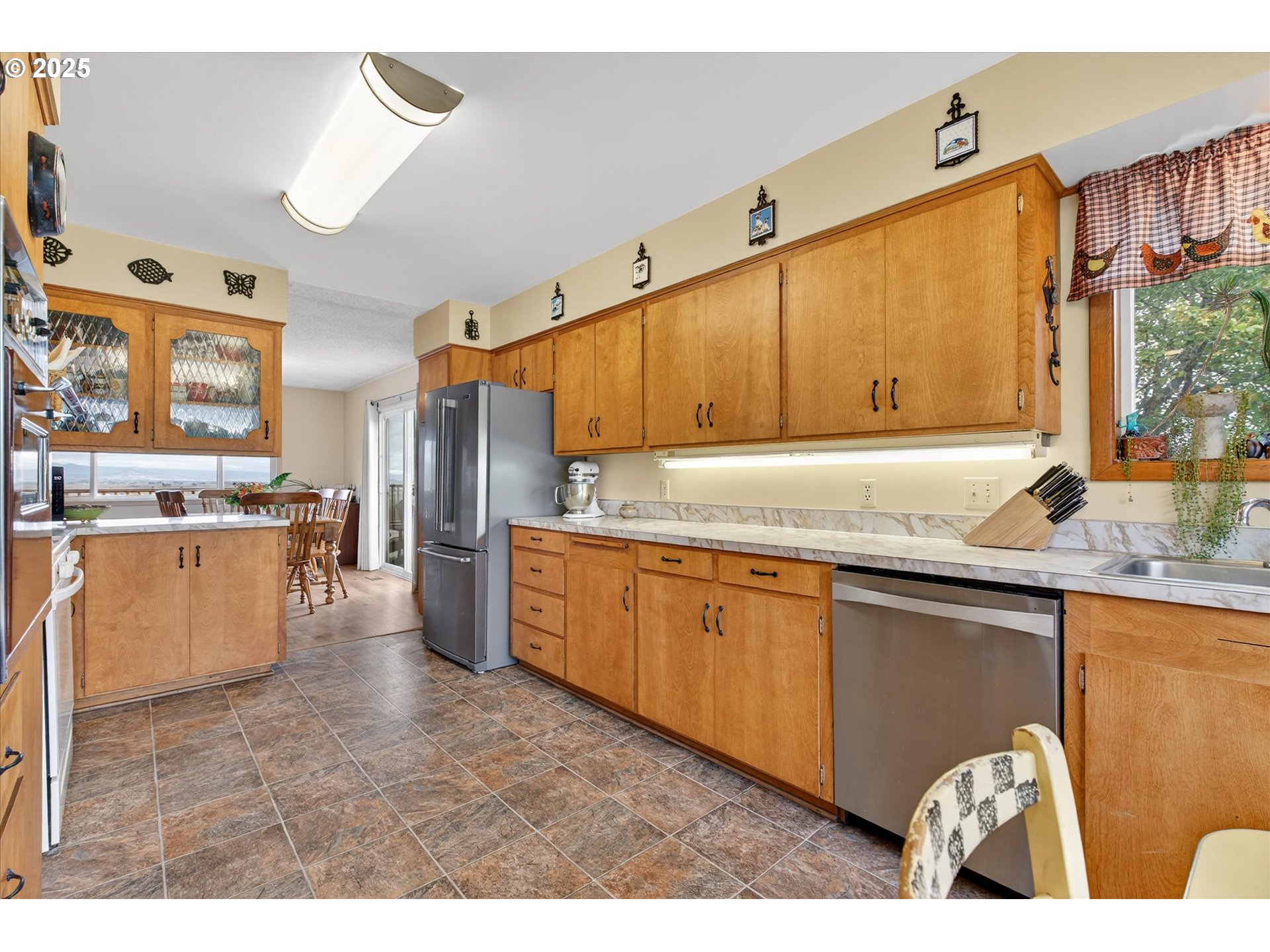 1025 17th Street Baker City, OR 97814 - Photo 22 of 48 a kitchen with granite countertop a sink a counter top space and stainless steel appliances