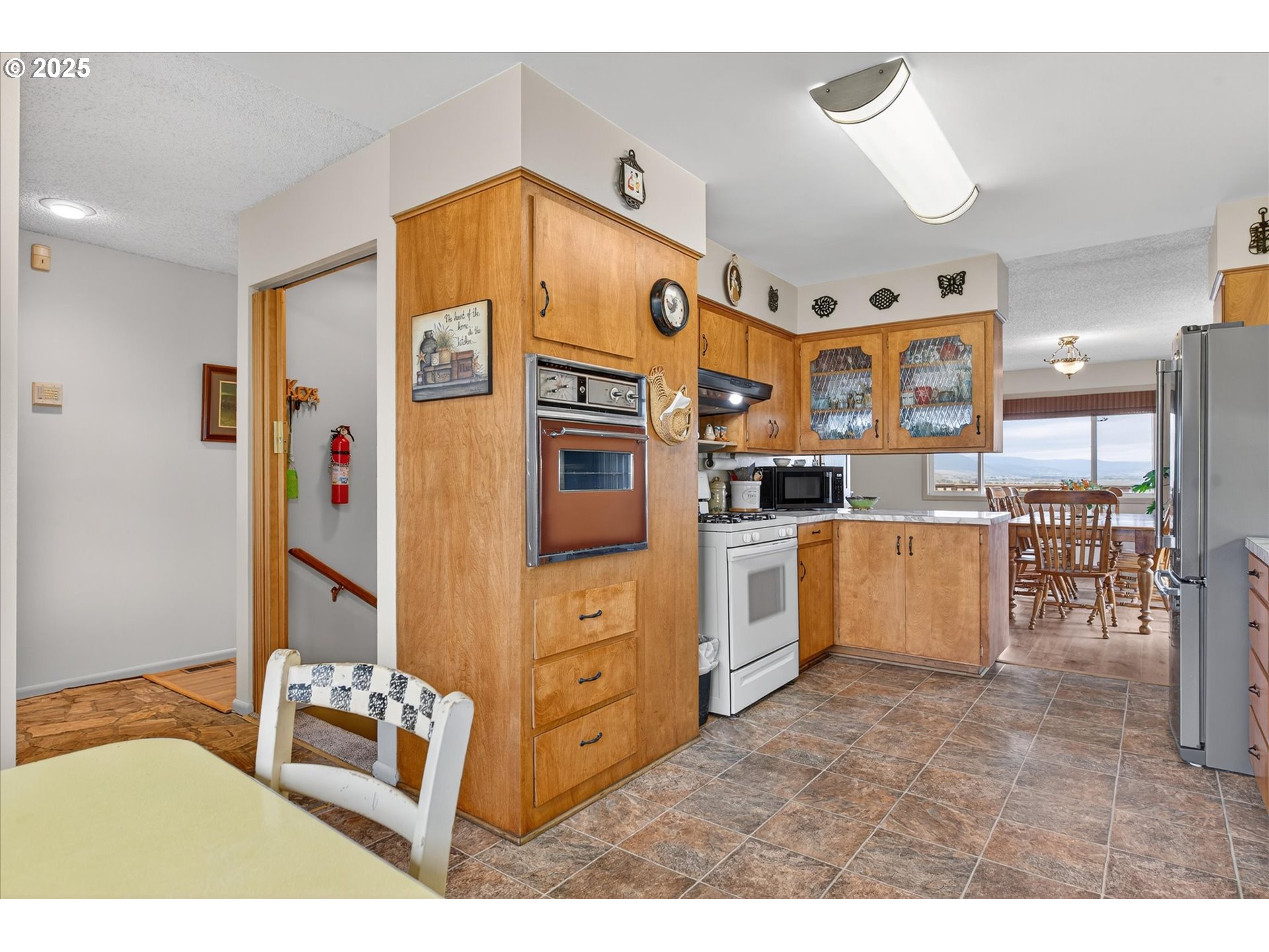 1025 17th Street Baker City, OR 97814 - Photo 25 of 48 a open kitchen with cabinets and wooden floor