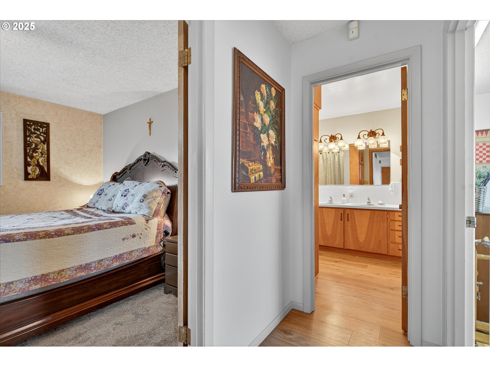 1025 17th Street Baker City, OR 97814 - Photo 27 of 48 a bedroom with a bed and a view of living room