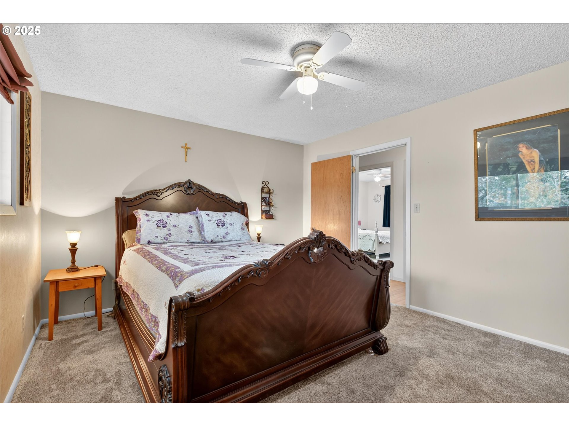 1025 17th Street Baker City, OR 97814 - Photo 29 of 48 a bedroom with a bed and a chandelier