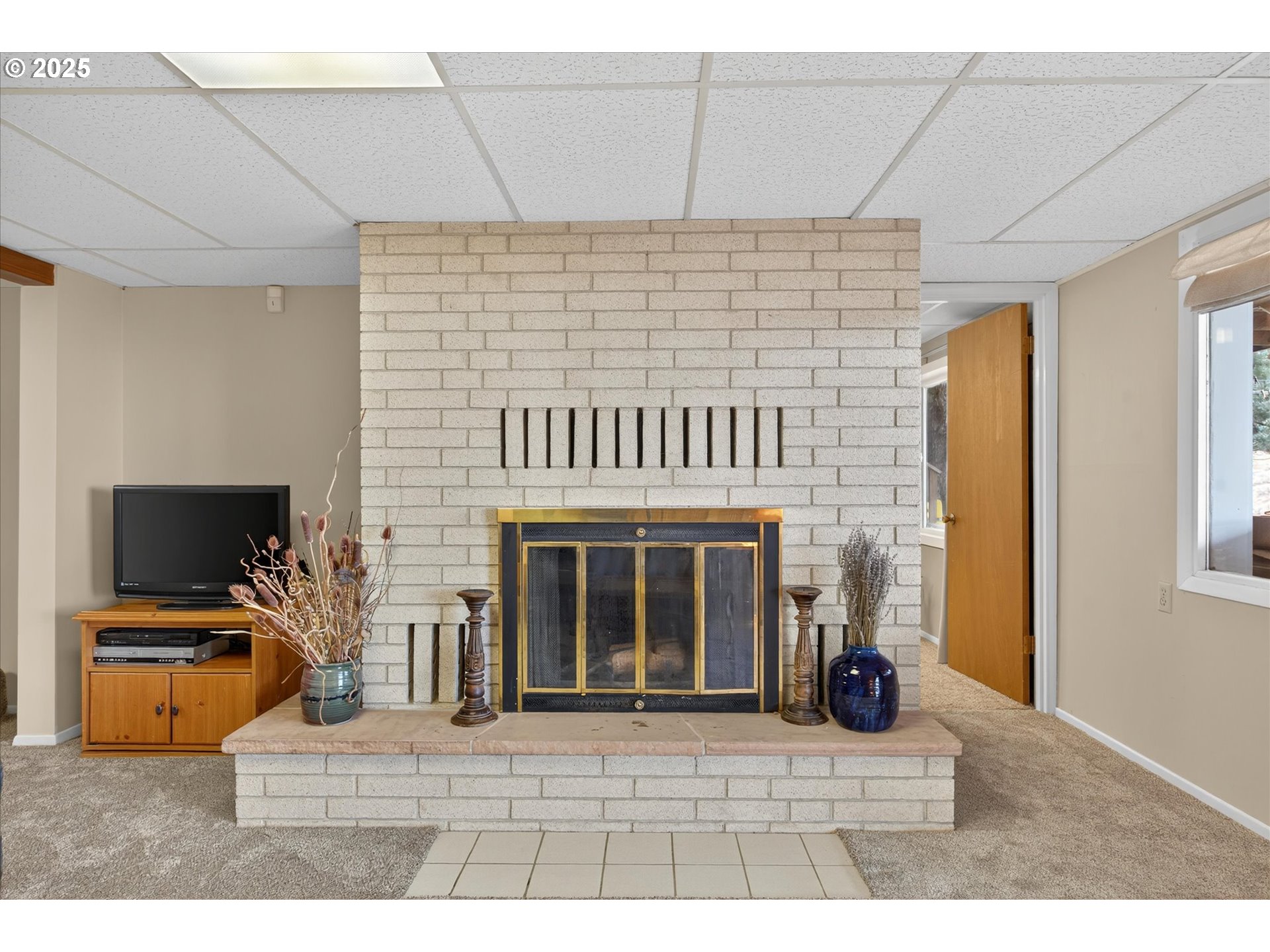 1025 17th Street Baker City, OR 97814 - Photo 37 of 48 a view of a livingroom with an empty space and a fireplace