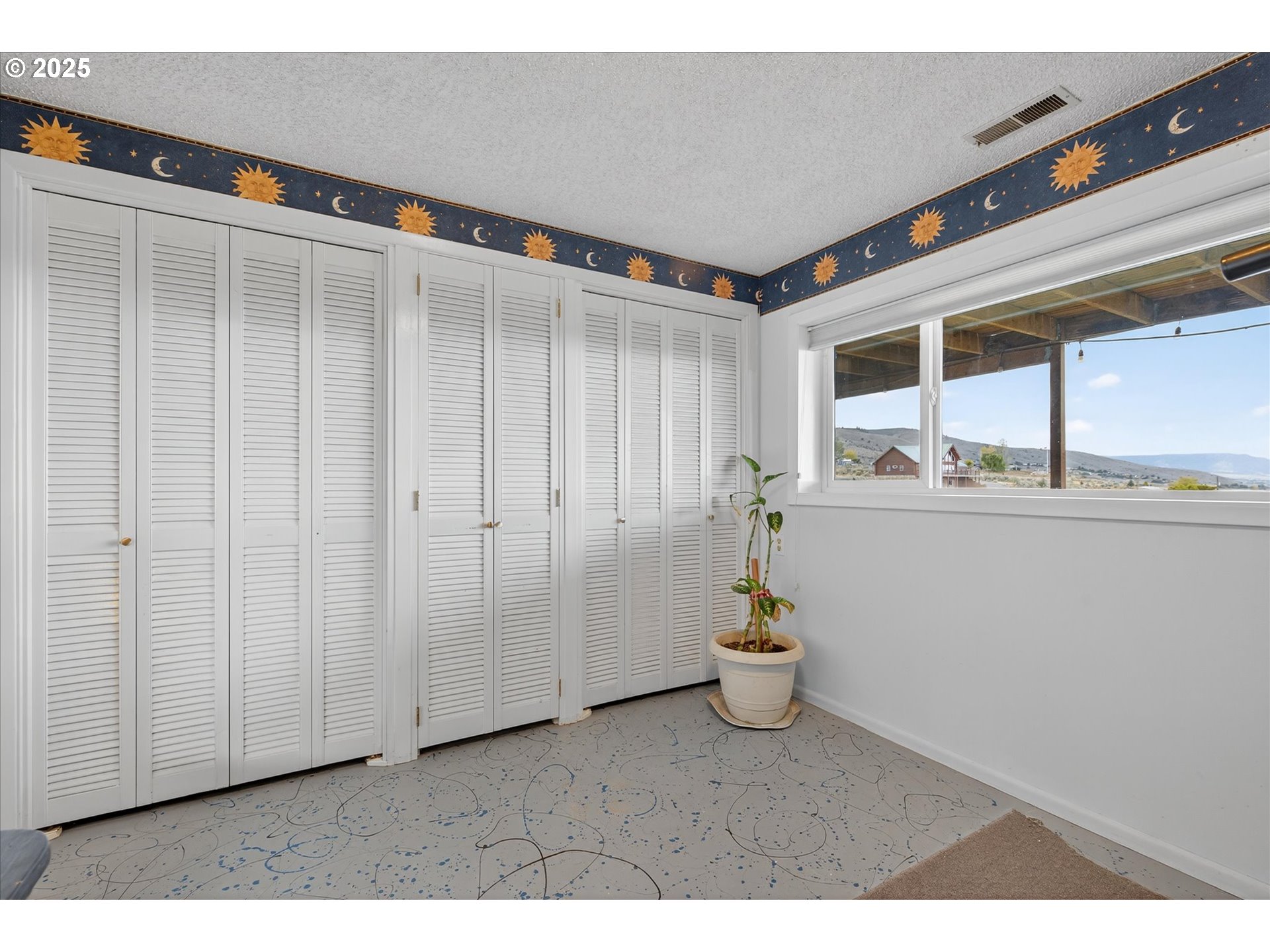 1025 17th Street Baker City, OR 97814 - Photo 41 of 48 a hallway with a white walls and wooden floor