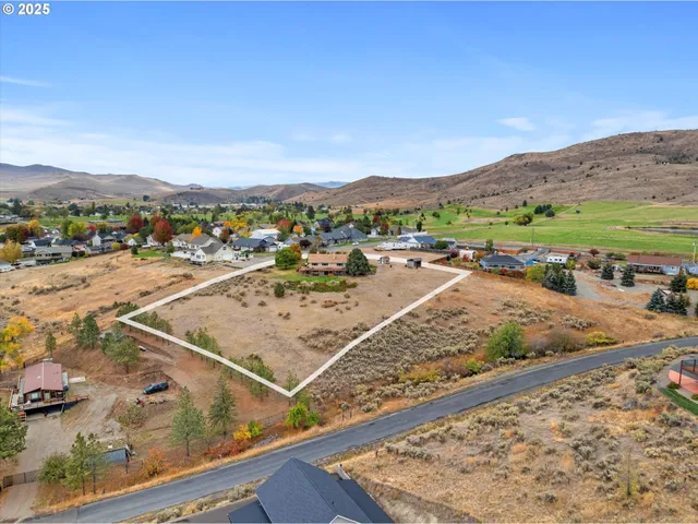 an aerial view of lake and residential houses
