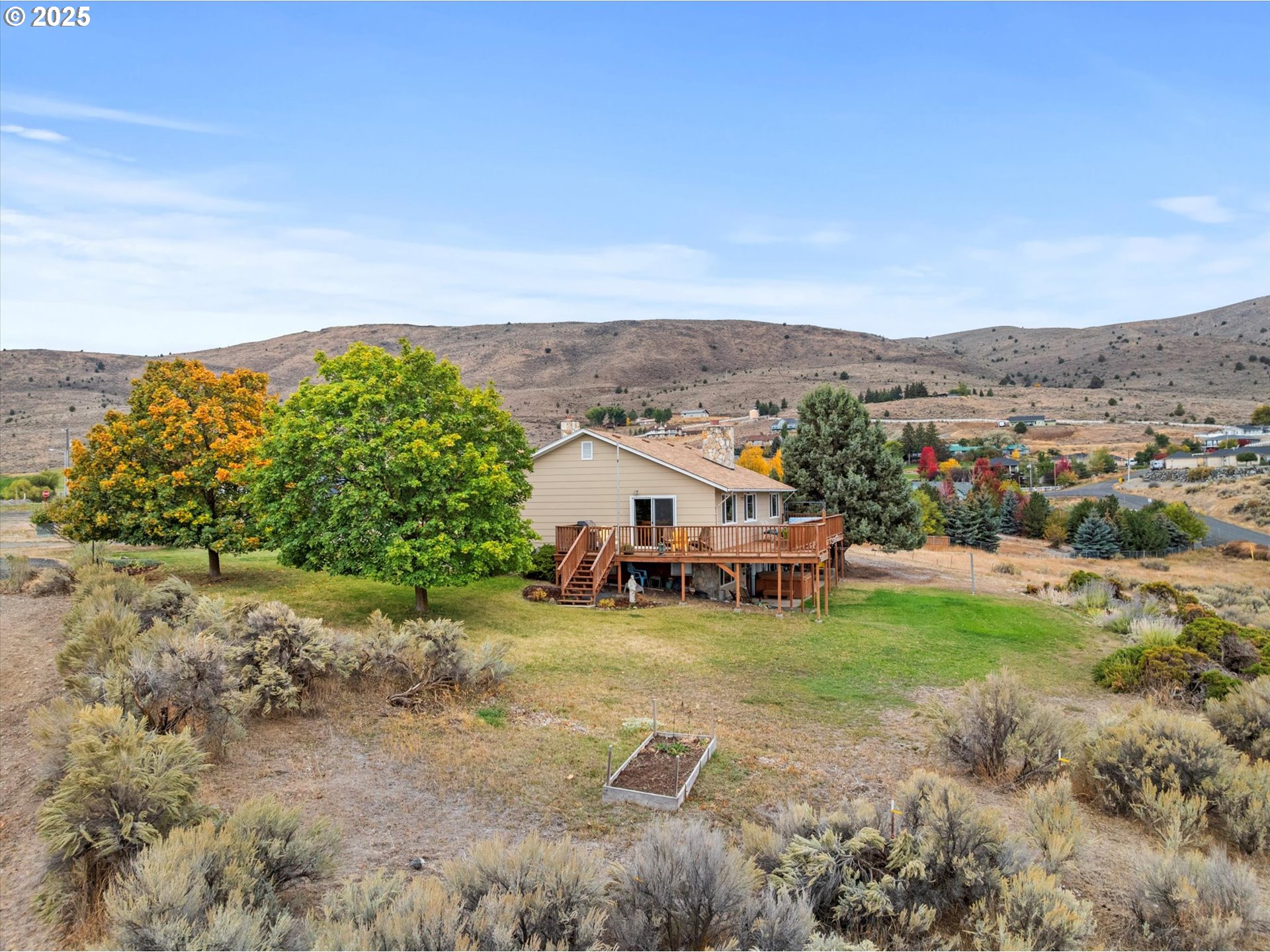 1025 17th Street Baker City, OR 97814 - Photo 8 of 48 an aerial view of a house with yard and mountain in the back