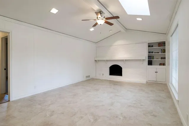 an view of fireplace and windows in it