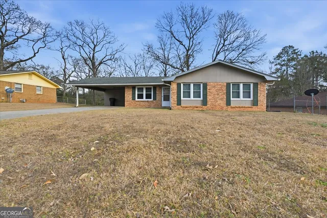 front view of a house with a yard