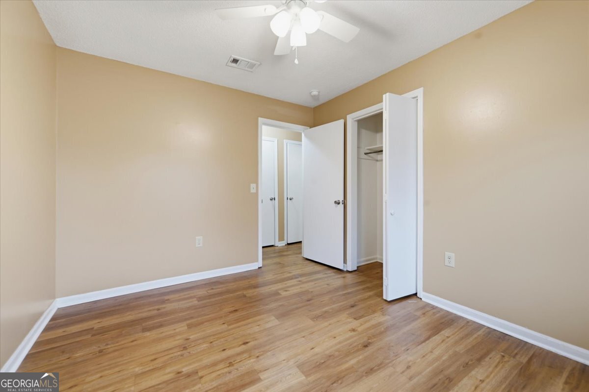 223 Randy Circle Warner Robins, GA 31088 - Photo 12 of 27 a view of an empty room with wooden floor