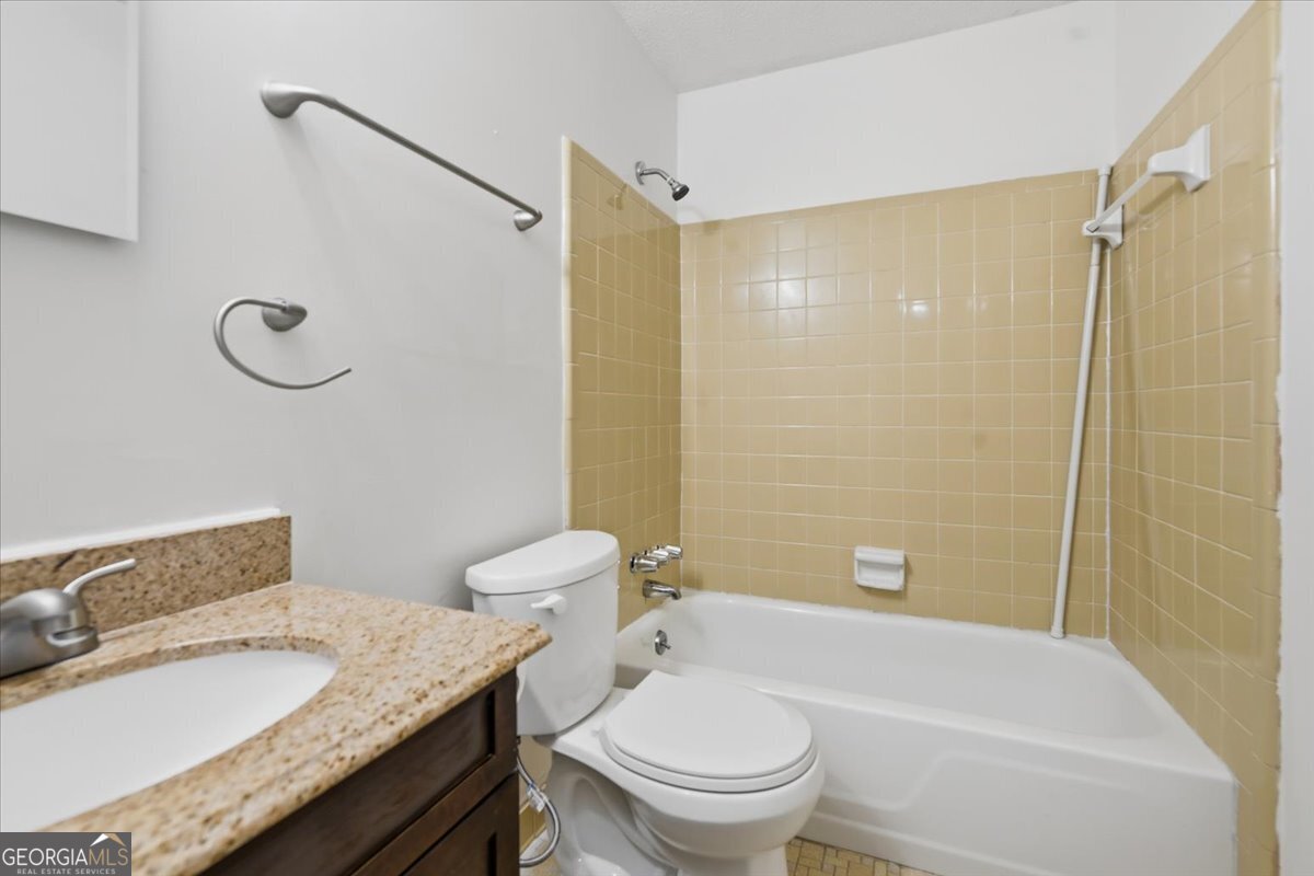 223 Randy Circle Warner Robins, GA 31088 - Photo 15 of 27 a bathroom with a granite countertop sink toilet and shower